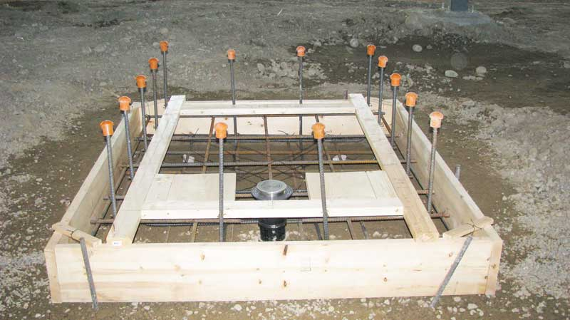 photo of a form built to pour concrete for an underground containment  system installation done by Tryangle Mechanical